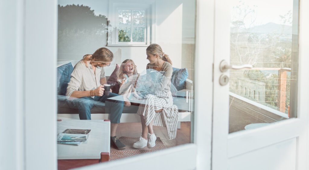 Family enjoying coffee together in a cozy living room, reflecting a warm atmosphere and togetherness, emphasizing comfort and relaxation.